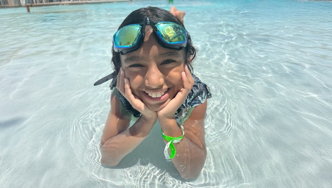 Chloe, a child cancer survivor, enjoying a day at the pool.